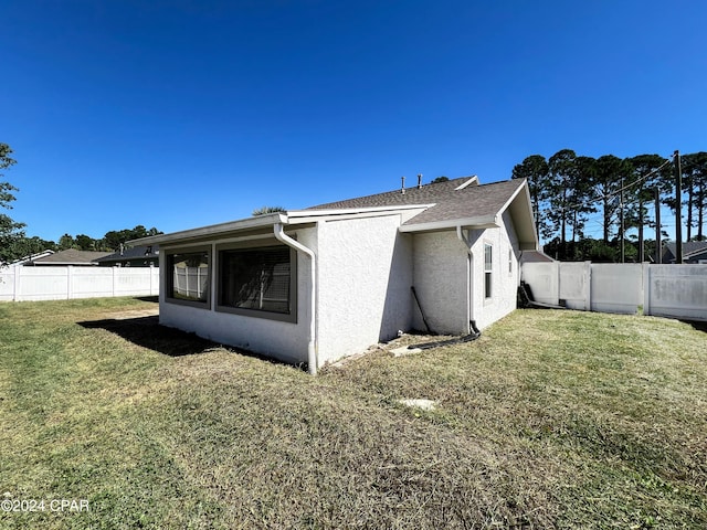 exterior space with a lawn