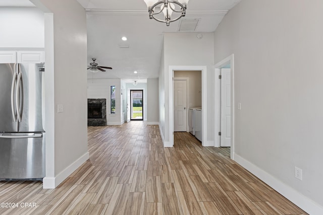 hall featuring light hardwood / wood-style floors and washer and clothes dryer