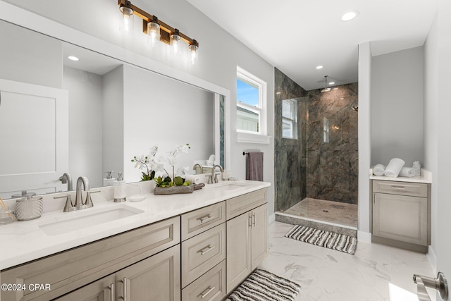 bathroom featuring a tile shower and vanity