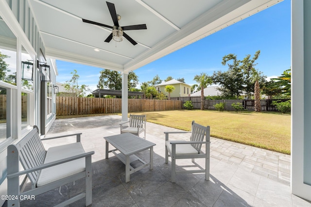 view of patio featuring ceiling fan