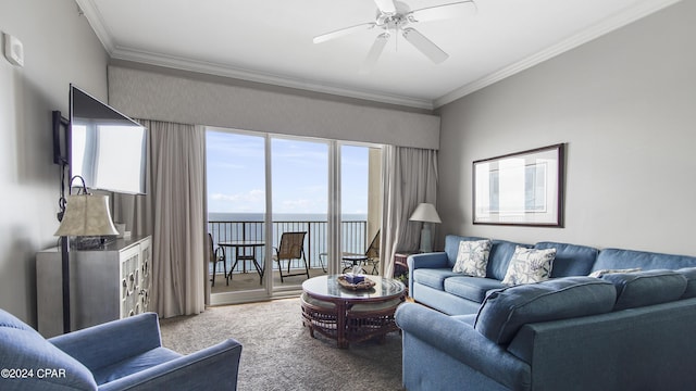 living area featuring ornamental molding, carpet floors, and a ceiling fan