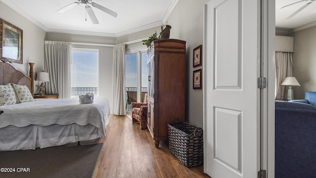 bedroom featuring access to outside, ornamental molding, wood finished floors, and a ceiling fan