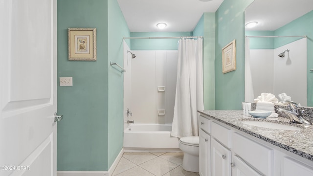 bathroom featuring toilet, shower / tub combo, vanity, baseboards, and tile patterned floors