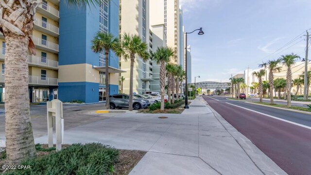 view of road featuring sidewalks and street lights