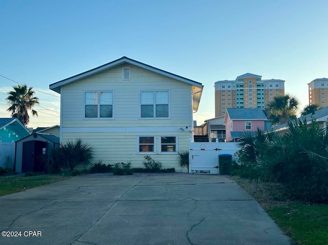 view of front facade with a shed