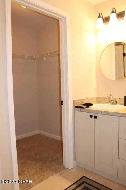 bathroom with vanity and tile patterned floors