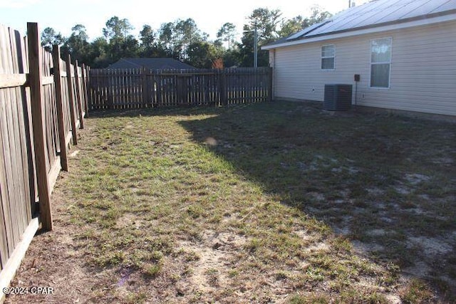 view of yard with central AC