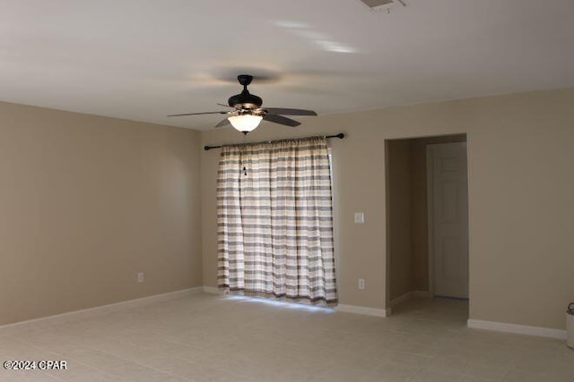 unfurnished room with ceiling fan