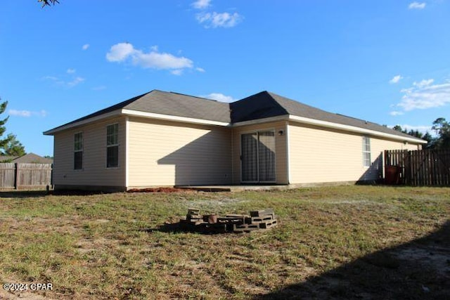 back of house with a yard