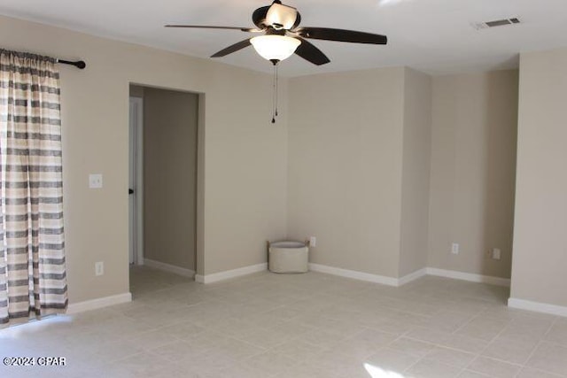 empty room featuring ceiling fan