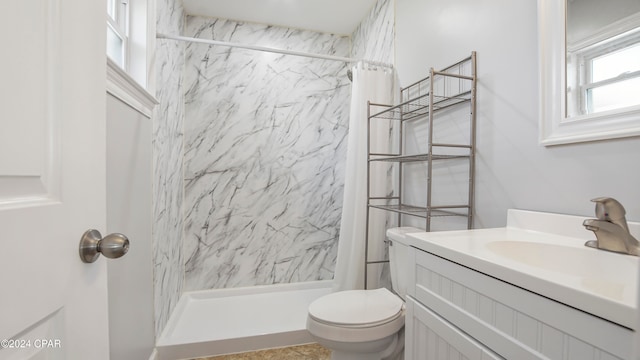 bathroom with vanity, toilet, and a shower with shower curtain