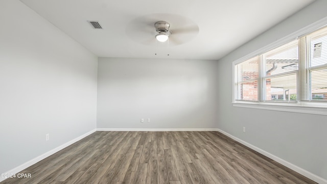 unfurnished room with hardwood / wood-style floors and ceiling fan