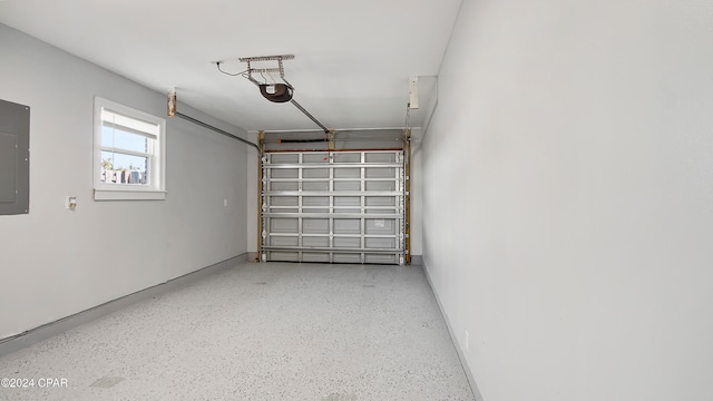 garage featuring a garage door opener and electric panel