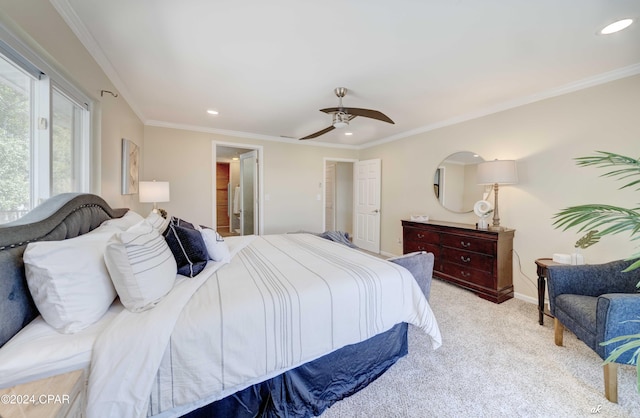 carpeted bedroom with ceiling fan and crown molding