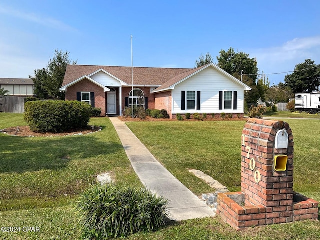 ranch-style home with a front yard