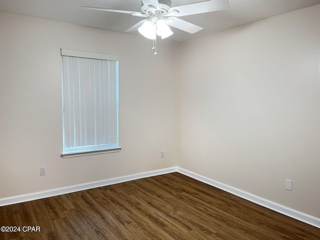 empty room with hardwood / wood-style flooring and ceiling fan