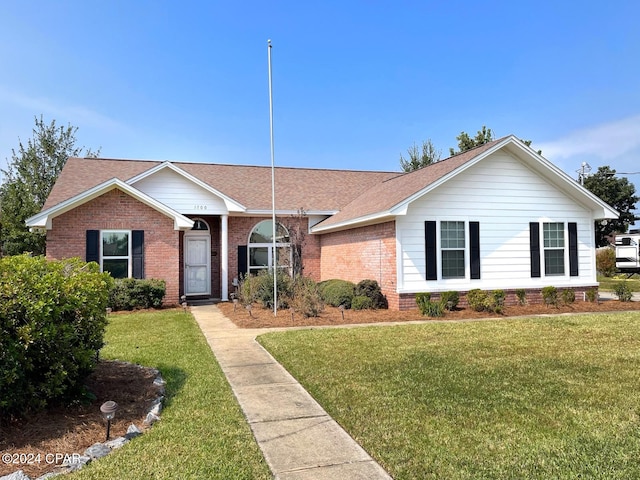 ranch-style house with a front lawn