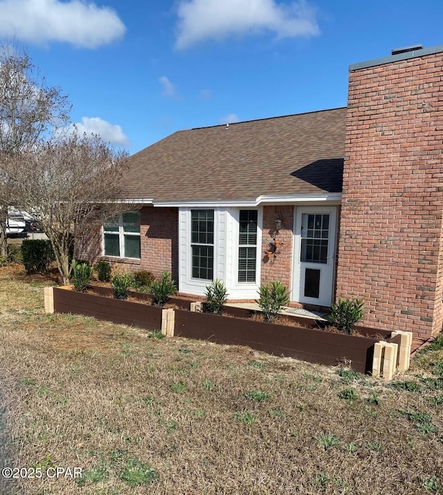 ranch-style home featuring a front yard