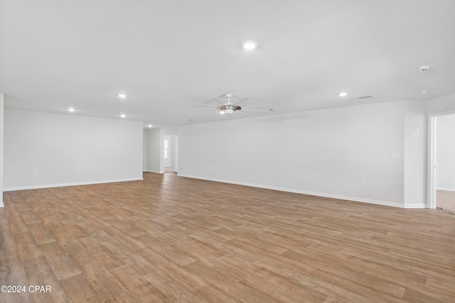 unfurnished room featuring light hardwood / wood-style flooring and ceiling fan