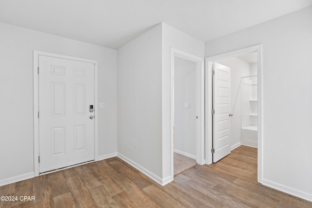 foyer entrance with light hardwood / wood-style flooring