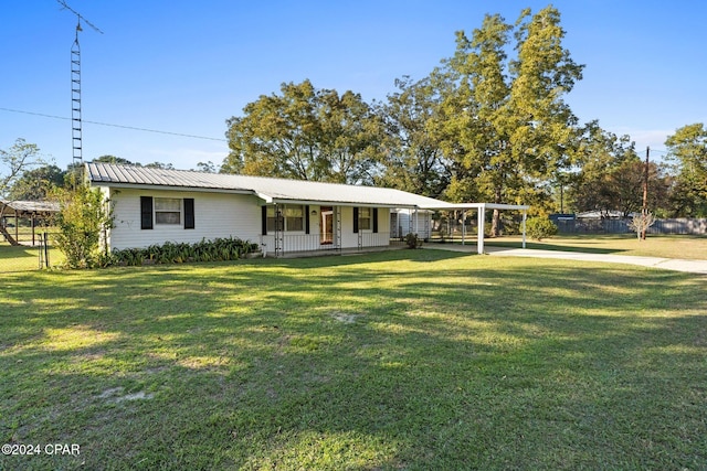 ranch-style home featuring a porch and a front yard