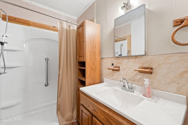 bathroom featuring vanity, crown molding, decorative backsplash, and curtained shower