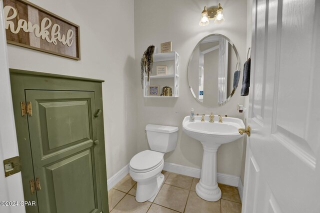 bathroom featuring tile patterned floors and toilet