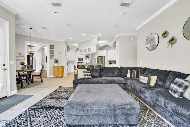 tiled living room featuring ornamental molding