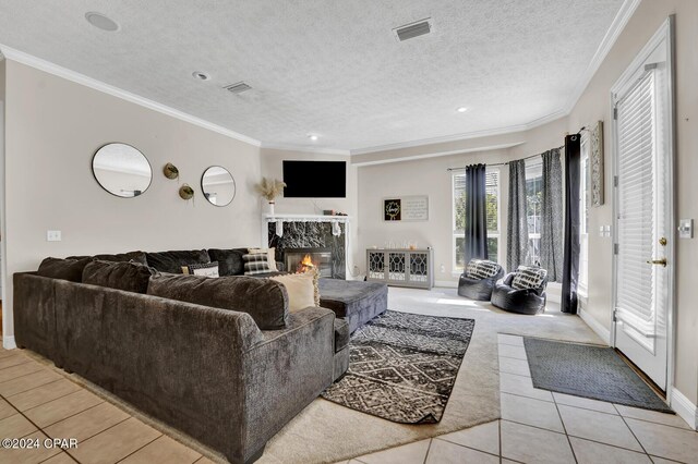 tiled living room featuring a premium fireplace, crown molding, and a textured ceiling