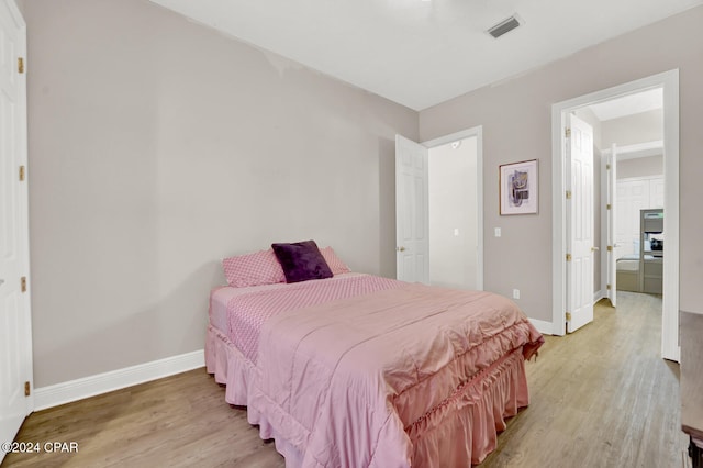 bedroom with light hardwood / wood-style floors