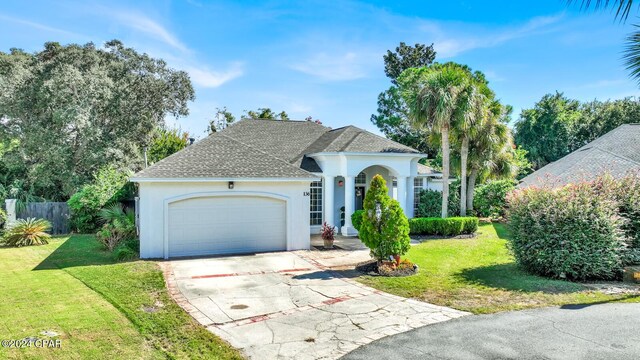 view of front facade with a garage and a front yard