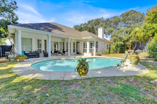 view of swimming pool featuring an outdoor living space and a patio area