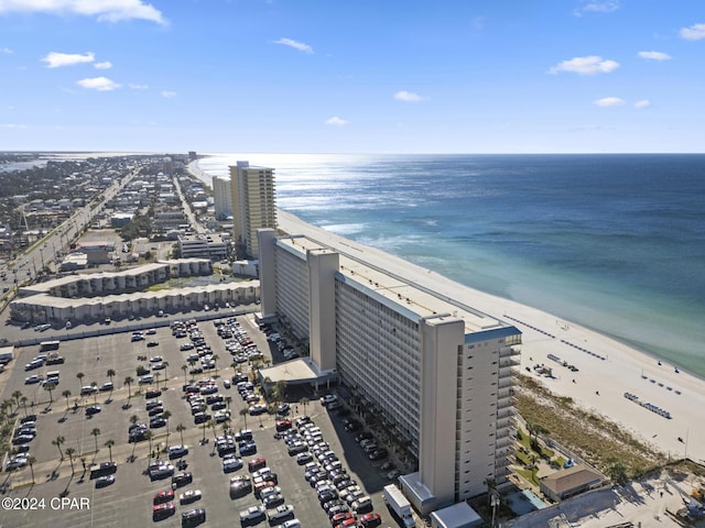 aerial view with a view of the beach, a water view, and a view of city