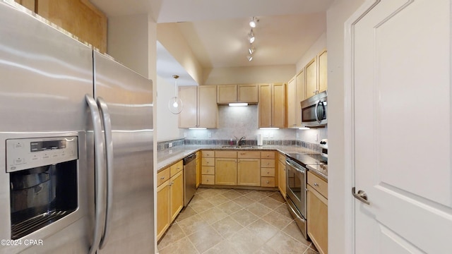 8700 Front Beach Rd Unit 5309, Panama City Beach, FL 32407 - kitchen featuring track lighting, light brown cabinetry, light tile patterned floors, stainless steel appliances, and a sink