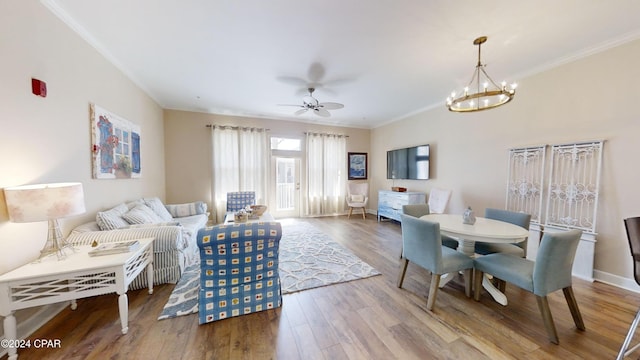 8700 Front Beach Rd Unit 5309, Panama City Beach, FL 32407 - living room with wood finished floors, crown molding, baseboards, and ceiling fan with notable chandelier