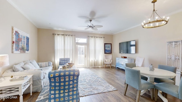 8700 Front Beach Rd Unit 5309, Panama City Beach, FL 32407 - living area with wood finished floors, crown molding, baseboards, and ceiling fan with notable chandelier