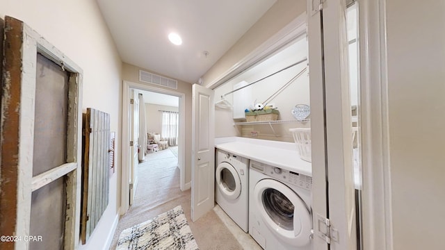8700 Front Beach Rd Unit 5309, Panama City Beach, FL 32407 - washroom with visible vents, separate washer and dryer, laundry area, and light colored carpet