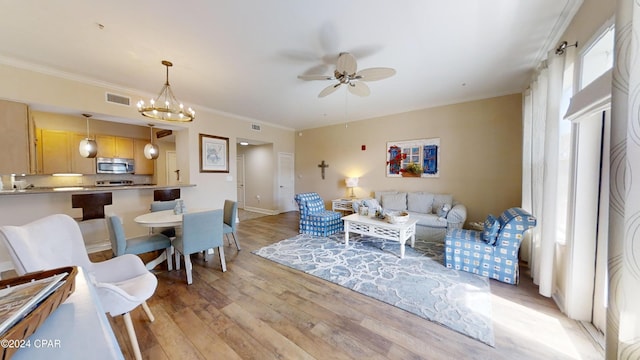 8700 Front Beach Rd Unit 5309, Panama City Beach, FL 32407 - living area featuring visible vents, light wood-type flooring, ornamental molding, and ceiling fan