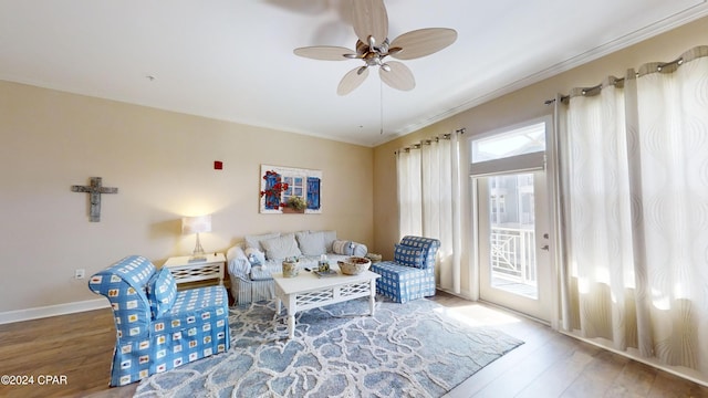 8700 Front Beach Rd Unit 5309, Panama City Beach, FL 32407 - living area featuring baseboards, wood finished floors, ceiling fan, and ornamental molding