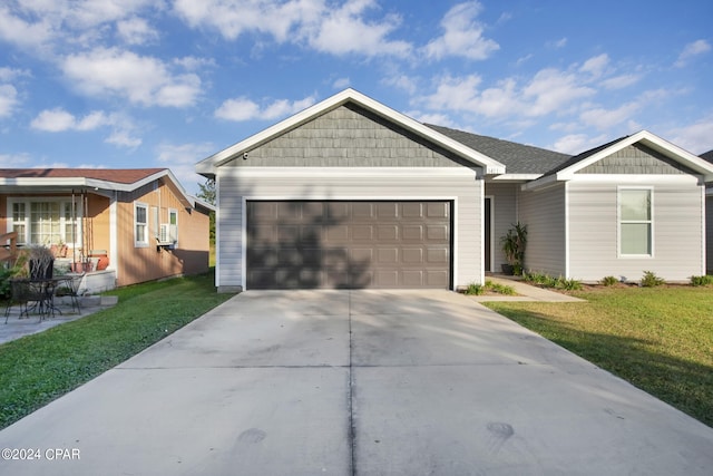 single story home with a front lawn and a garage