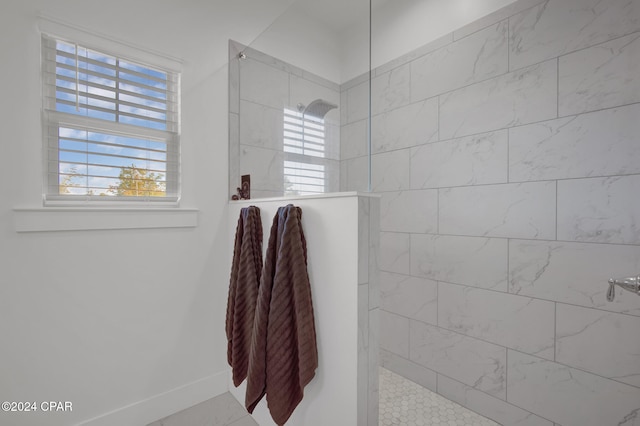 bathroom with tiled shower