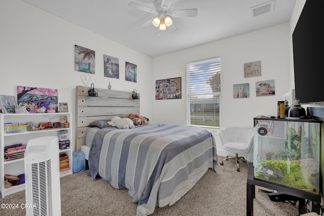 bedroom featuring light carpet and ceiling fan