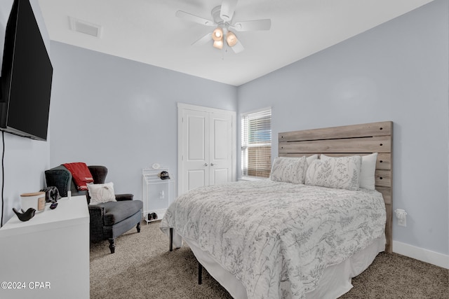 carpeted bedroom with a closet and ceiling fan