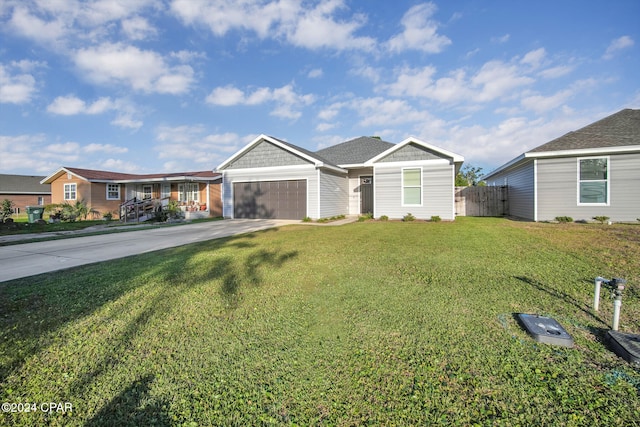 ranch-style home with a front yard and a garage