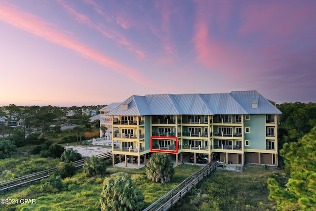 view of outdoor building at dusk