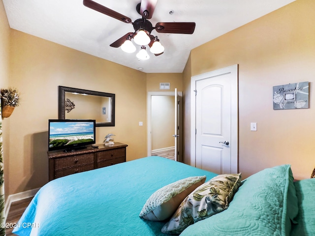 bedroom featuring lofted ceiling and ceiling fan