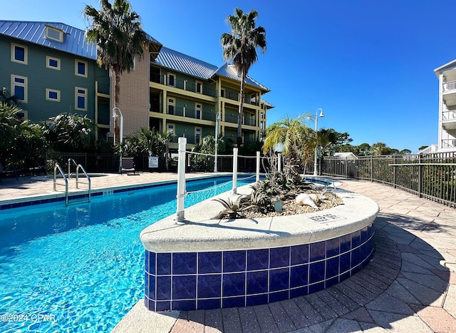 view of pool featuring a patio