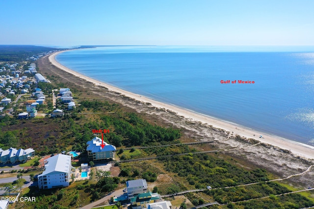 drone / aerial view featuring a water view and a beach view