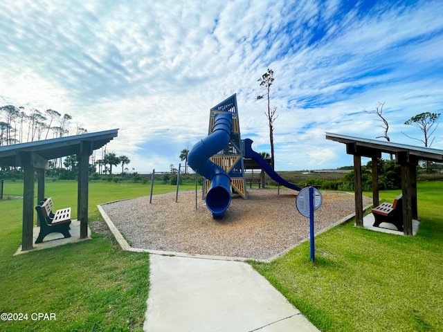 view of jungle gym with a lawn