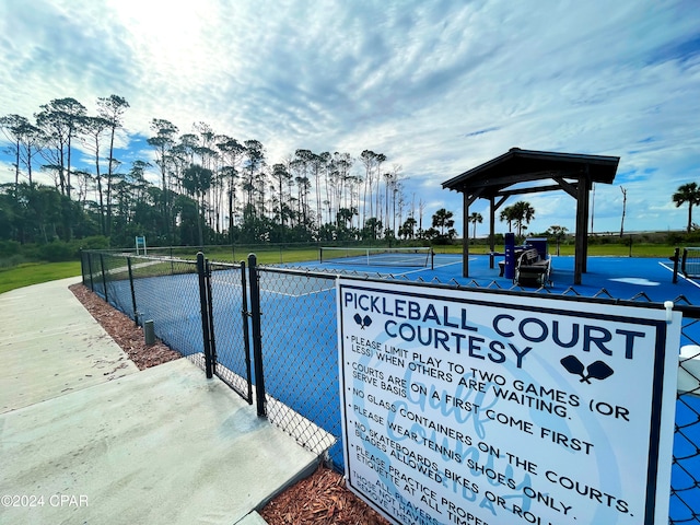 exterior space with tennis court